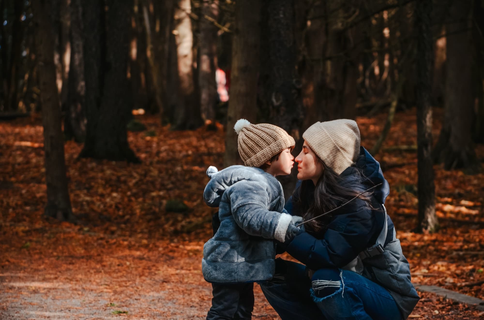 Mother and child in an autumn forest